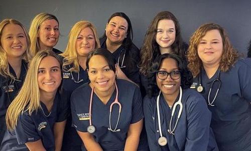 Online Respiratory Therapist to RN Online Students in Scrubs Smiling 