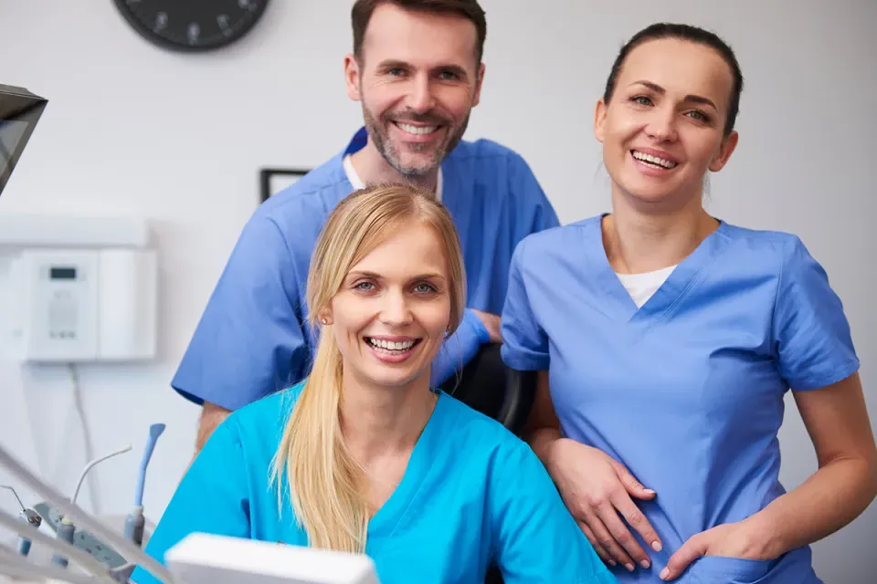 Smiling Team of Medical Assistants in Clinic