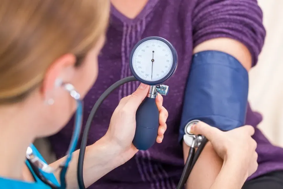 Medical Assistant Reading Stethoscope